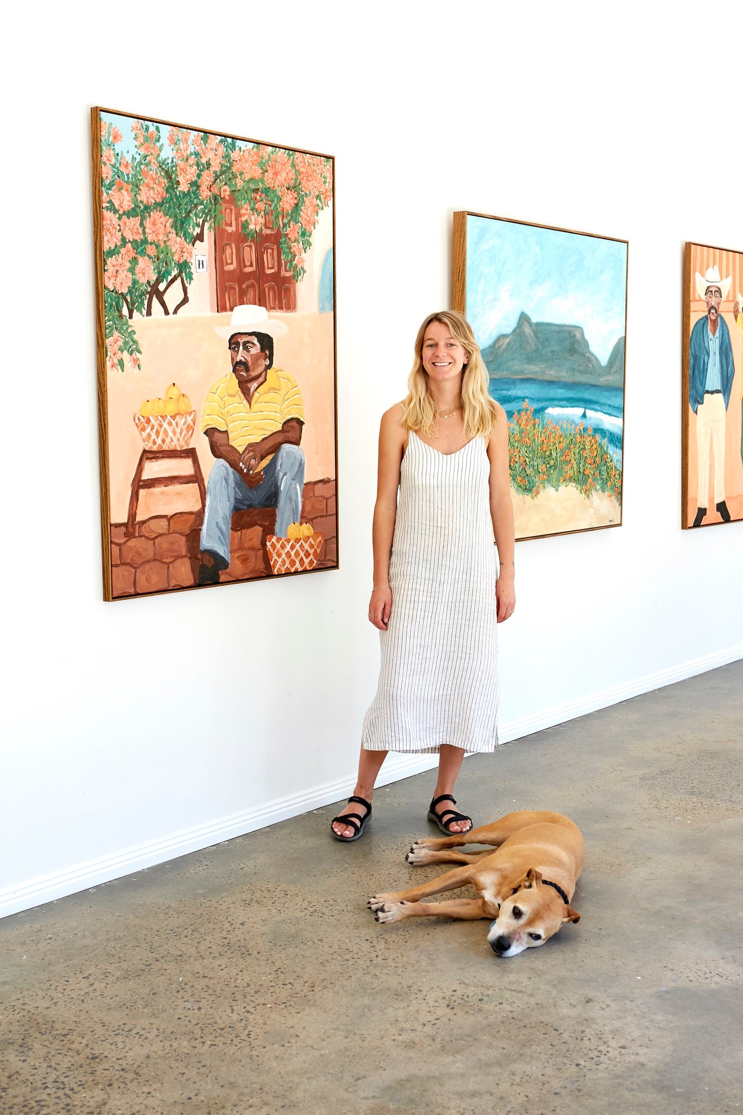 Sammy Veall standing in the middle of one of her exhibitions